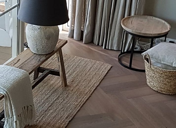 Gemuetliches Wohnzimmer im Ferienhaus in Ruurlo mit komfortabler Sitzecke in Achterhoek, Gelderland.