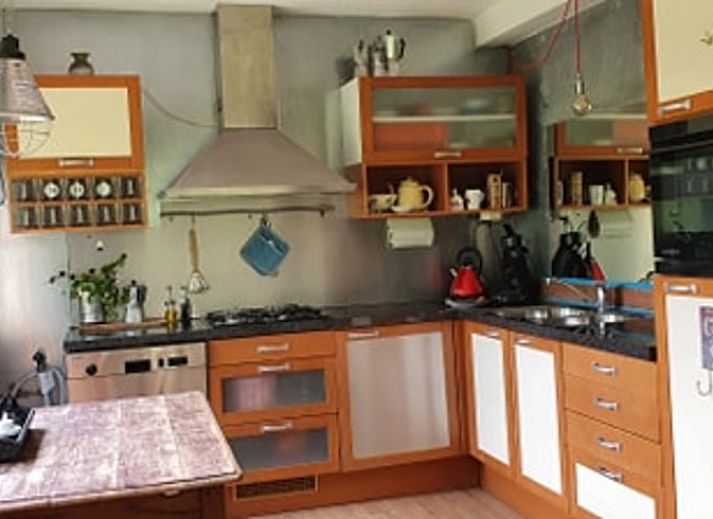 Cozy living room in Holiday Home in Ruurlo, Achterhoek, with spacious seating and views of the green nature of Gelderland.