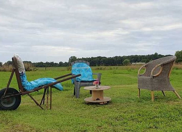 Modern kitchen in Holiday Home in Ruurlo, Achterhoek, with wooden cabinets and stainless steel appliances, ideal for cooking in Gelderland.