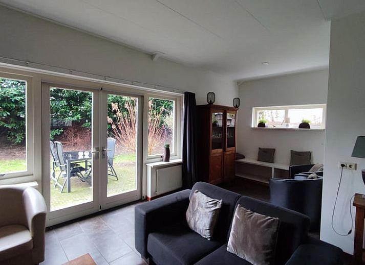 Enjoy the green surroundings on the terrace of Huisje in Aalten, a charming vacation home in the Achterhoek region of Gelderland.