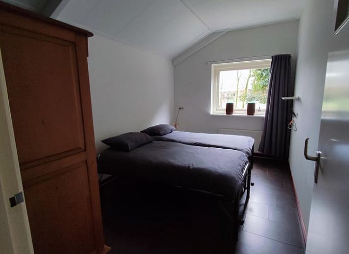 Enjoy the green surroundings on the terrace of Huisje in Aalten, a charming vacation home in the Achterhoek region of Gelderland.