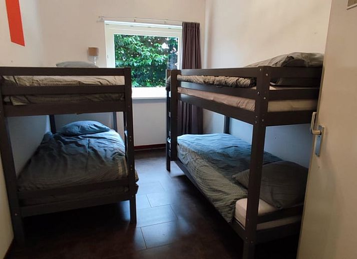 Enjoy the green surroundings on the terrace of Huisje in Aalten, a charming vacation home in the Achterhoek region of Gelderland.