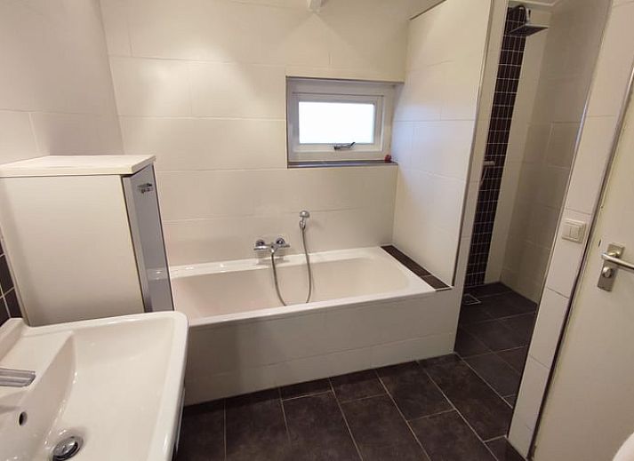 Playground equipment with slide at Huisje in Aalten, vacation home in the green Achterhoek region of Gelderland, ideal for families with children.