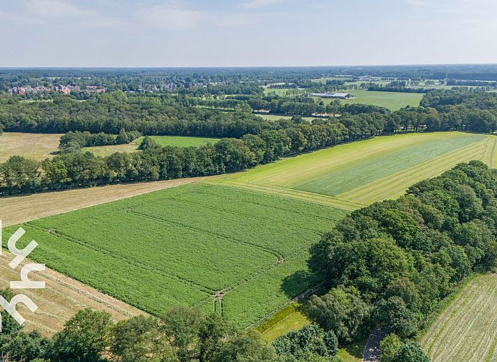 Cozy bedroom in DG168 vacation home, Aalten, with atmospheric murals.
