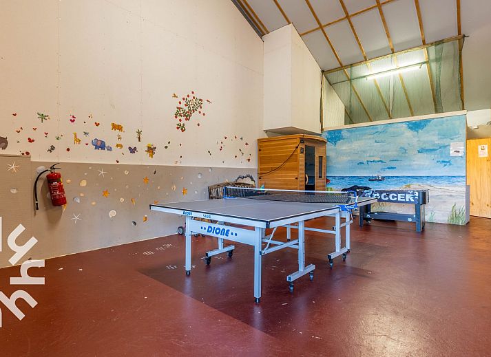 Cozy bedroom in DG168 vacation home, Aalten, with atmospheric murals.