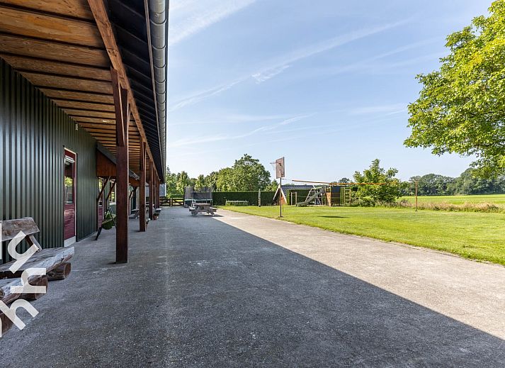 Cozy bedroom in DG168 vacation home, Aalten, with atmospheric murals.