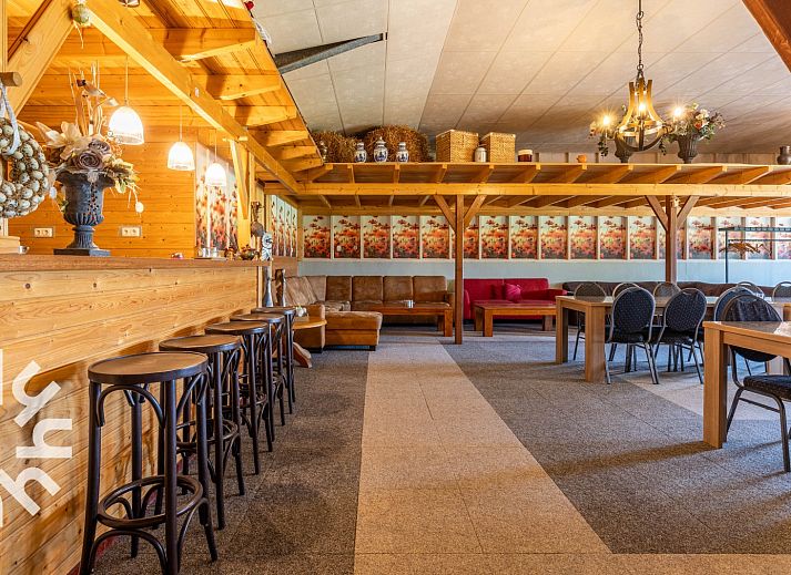 Cozy bedroom in DG168 vacation home, Aalten, with atmospheric murals.