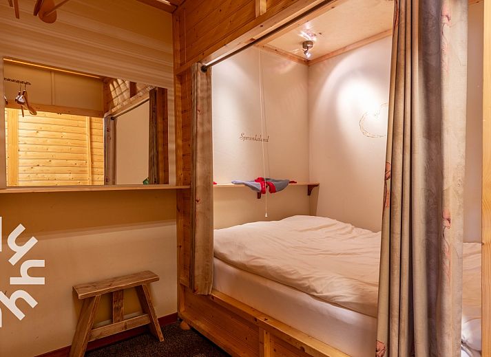 Cozy bar in DG168 vacation home, Aalten, Achterhoek with wooden interior.