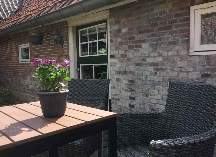 Sunny terrace at vacation home DG529 in Aalten, Achterhoek, with cozy seating area.