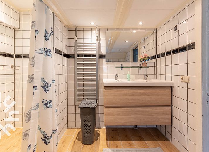 Sunny terrace at vacation home DG529 in Aalten, Achterhoek, with cozy seating area.