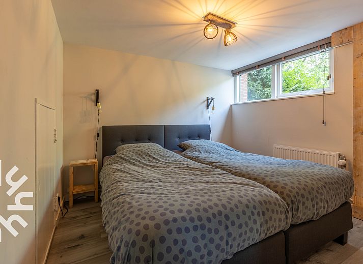 Geniet van de serene tuin bij vakantiehuis DG994 in Aalten, Achterhoek, Gelderland.