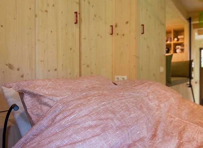 Huisje in Aalten, een vakantiehuis in de Achterhoek, Gelderland, omgeven door groene natuur en rustieke charme.