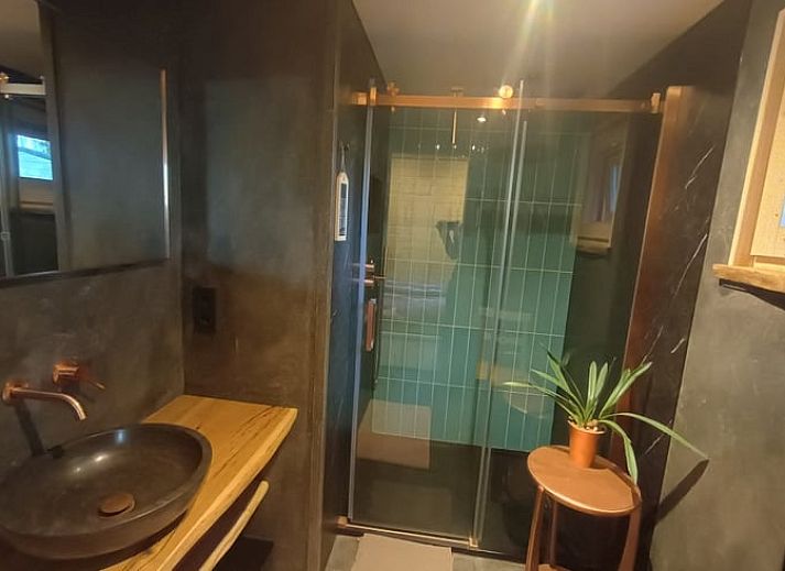 Cozy living room in cottage in Lochem with comfortable seating area in Gelderland.