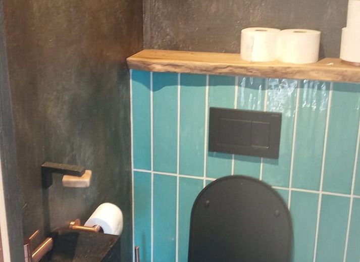 Cozy living room in cottage in Lochem with comfortable seating area in Gelderland.