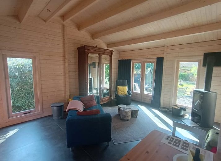 Cozy living room in cottage in Lochem with comfortable seating area in Gelderland.