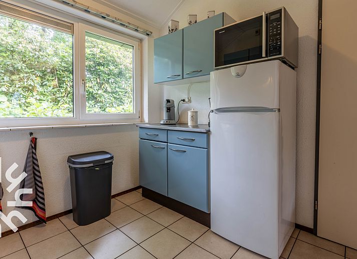 Terrace of vacation home DG590 in Lochem, Achterhoek, Gelderland with garden furniture and barbecue.