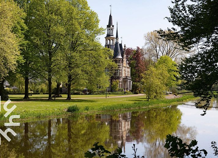 Bedroom in DG590 vacation home in Lochem, Achterhoek with comfortable bed and natural light.