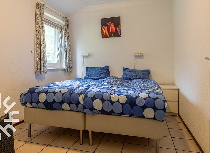 Front view of vacation home DG590 in Lochem, Achterhoek, surrounded by green nature.