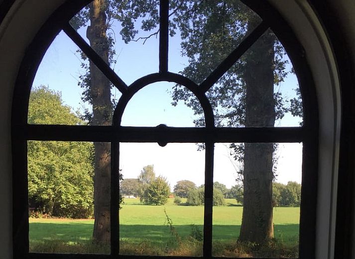 Huisje in Lochem, een charmant vakantiehuis in de Achterhoek, Gelderland, met authentieke bakstenen gevel en landelijke uitstraling.