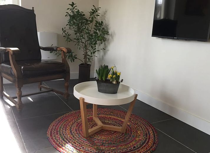 Huisje in Lochem, een charmant vakantiehuis in de Achterhoek, Gelderland, met authentieke bakstenen gevel en landelijke uitstraling.