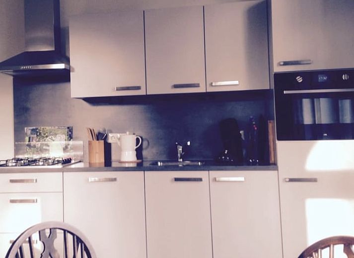 Huisje in Lochem, een charmant vakantiehuis in de Achterhoek, Gelderland, met authentieke bakstenen gevel en landelijke uitstraling.