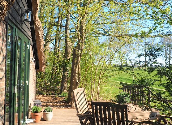 Vakantiehuisje in Harfsen met een rustieke veranda in de Achterhoek, Gelderland