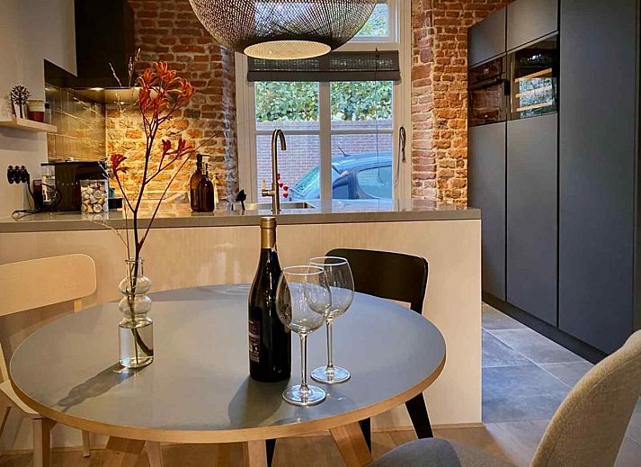 Cozy garden of vacation home DG1292 in Doesburg, Achterhoek, with terrace and green surroundings.