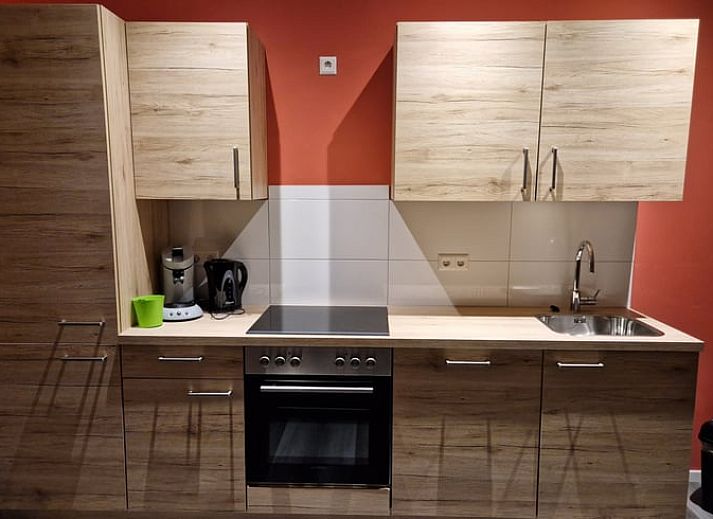 Gezellige woonkamer in Vakantiehuisje in Wichmond, Achterhoek, met comfortabele zithoek en stijlvolle inrichting.