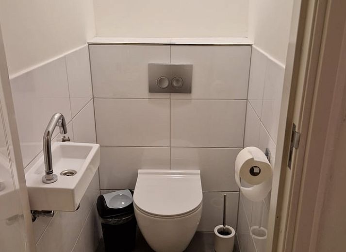 Gezellige woonkamer in Vakantiehuisje in Wichmond, Achterhoek, met comfortabele zithoek en stijlvolle inrichting.