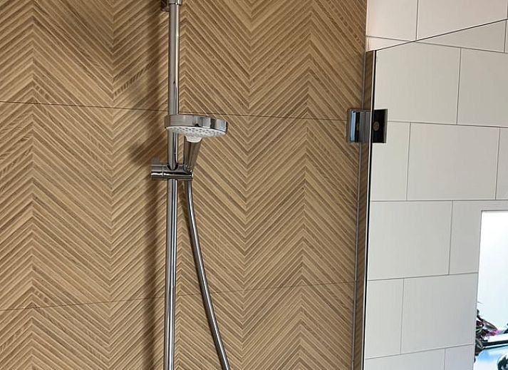 Stylish interior of Holiday Home in Zutphen, Achterhoek, Gelderland with cozy sitting area and dining area.