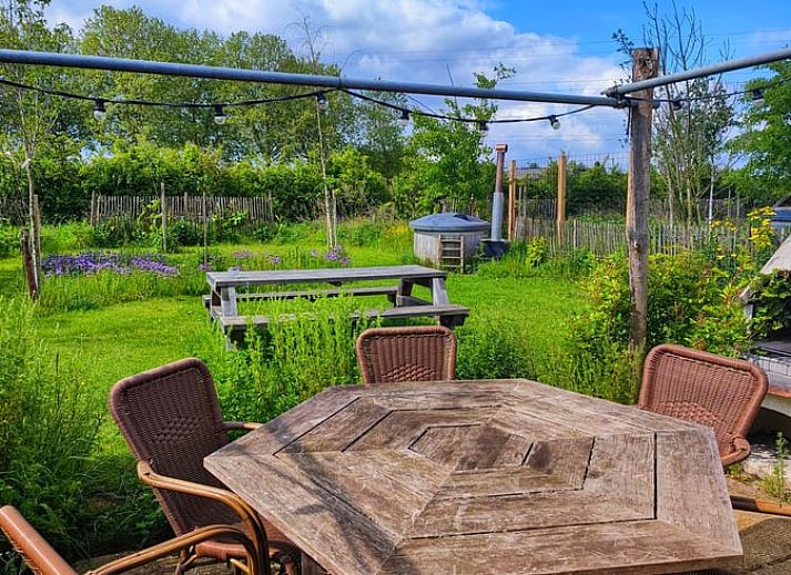 Cozy terrace at Holiday home in Zutphen, surrounded by green nature in Achterhoek, Gelderland.