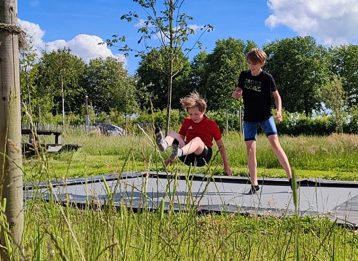 Dining area in Holiday home in Zutphen with modern kitchen, located in Achterhoek, Gelderland.