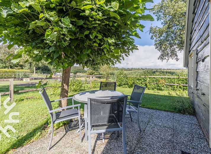 Cozy interior of vacation home DG496 in Vorden, Achterhoek, with wooden interior.