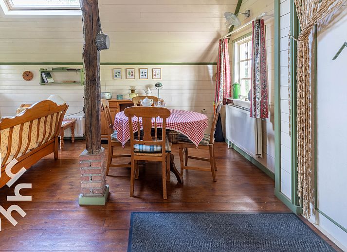 Cozy interior of vacation home DG496 in Vorden, Achterhoek, with wooden interior.