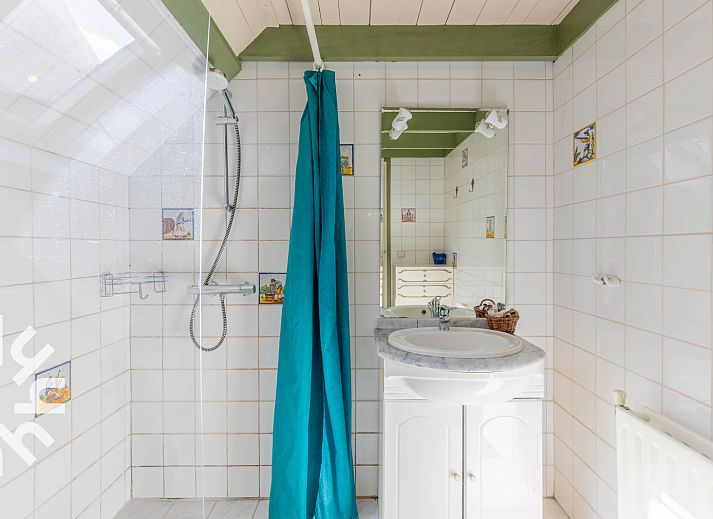 Terrace at vacation home DG496 in Vorden, Achterhoek, overlooking green fields.