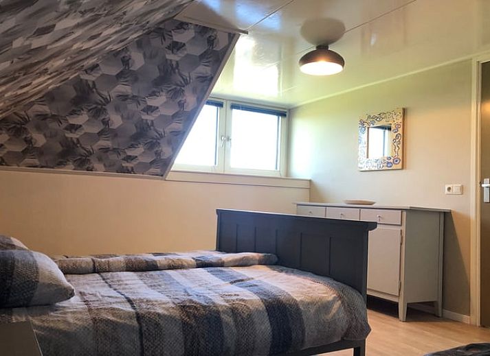 Ferienhaus in Doetinchem mit Reetdach, umgeben von einem gruenen Garten in der Region Achterhoek, Gelderland, ideal fuer einen entspannten Aufenthalt.