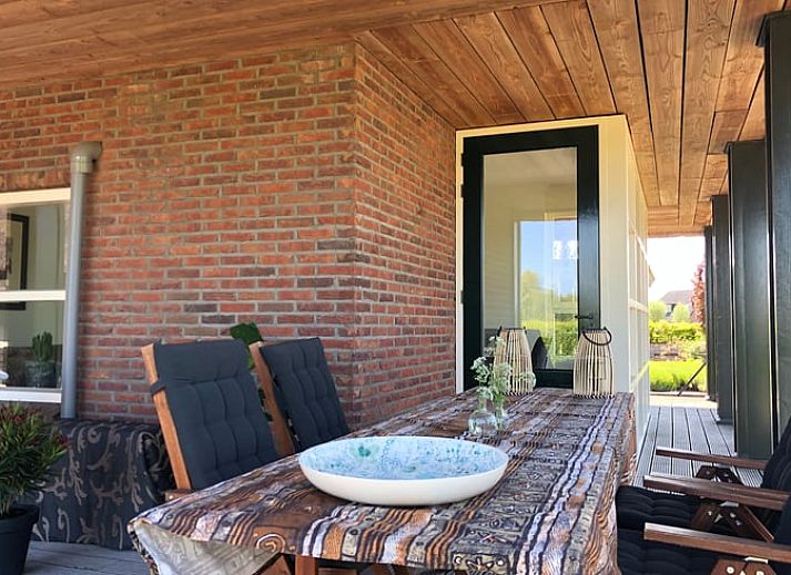 Gemuetliches Wohnzimmer des Ferienhauses in Doetinchem mit stilvoller Einrichtung, gelegen in der Region Achterhoek, Gelderland.