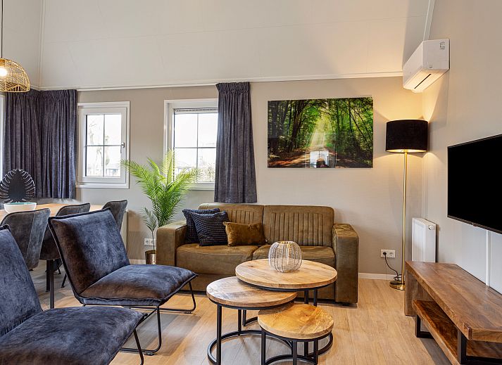 Module Notario Deluxe vakantiehuis in Lichtenvoorde, Achterhoek, met charmante houten gevel en groene tuin.