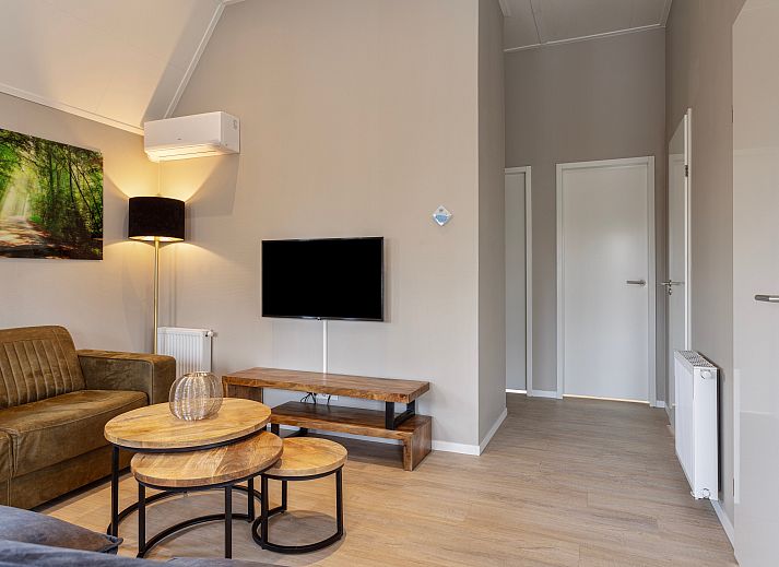 Module Notario Deluxe vakantiehuis in Lichtenvoorde, Achterhoek, met charmante houten gevel en groene tuin.