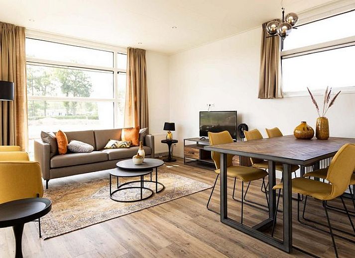 Cozy bedroom in Module Special 6 persons Wellness, Lichtenvoorde, with comfortable beds and warm tones.