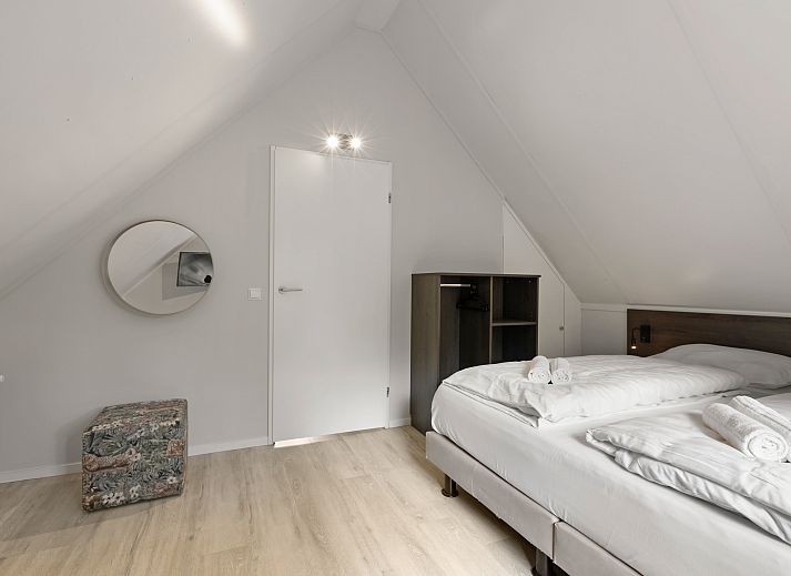 Gezellige zithoek in de Stroombroek 4-persoons wellnessbungalow, Braamt, omgeven door de natuur van de Achterhoek, Gelderland.