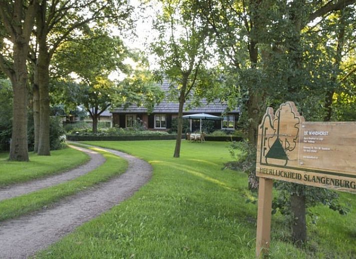 Atmospheric evening at Holiday home in Gaanderen, Achterhoek, Gelderland with illuminated porch.