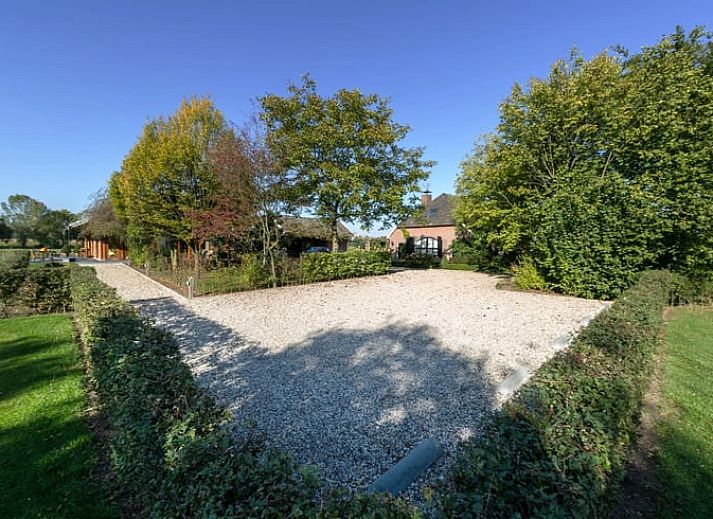 Atmospheric evening at Holiday home in Gaanderen, Achterhoek, Gelderland with illuminated porch.