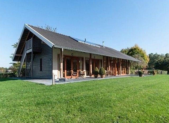 Sunny terrace of Holiday home in Gaanderen, overlooking the nature of Achterhoek, Gelderland.