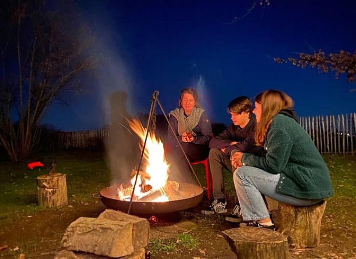 Cozy indoor area of Holiday Home in Lievelde, Achterhoek, Gelderland with comfortable seating area and warm atmosphere.