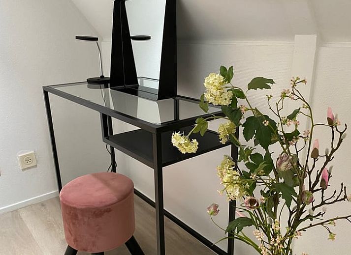 Outdoor terrace of cottage in Lievelde, Achterhoek, surrounded by greenery.