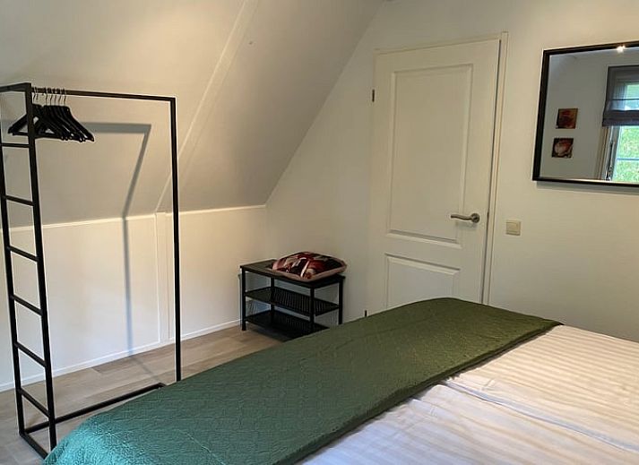 Outdoor terrace of cottage in Lievelde, Achterhoek, surrounded by greenery.