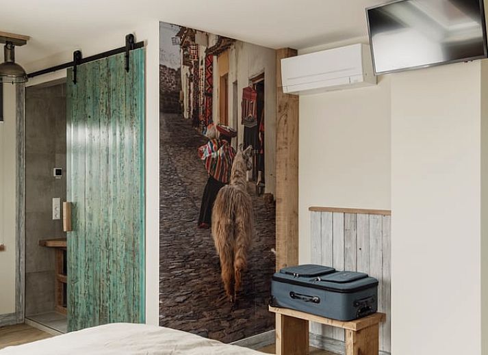 Cottage in De Heurne, einem charmanten Ferienhaus in Achterhoek, Gelderland, mit ruhigem Blick auf die gruene Landschaft.