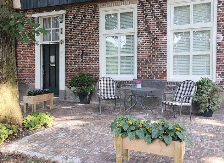 Cozy living room of cottage in Winterswijk Kotten, equipped with modern conveniences in Gelderland.