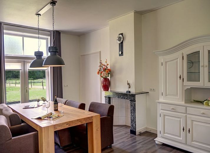 Backyard of Cottage in Winterswijk Kotten, with lush plants and serene atmosphere in Achterhoek, Gelderland.